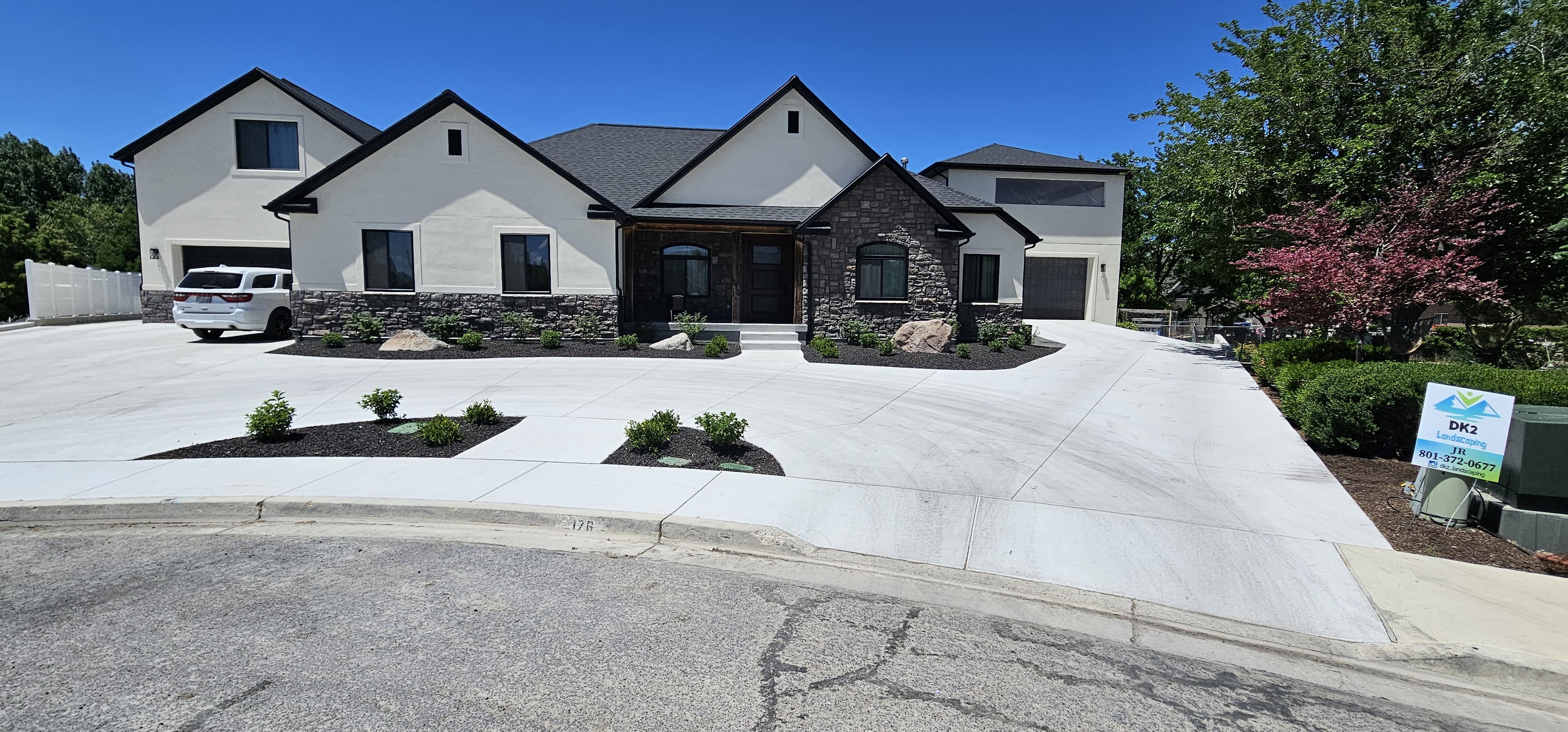 Concrete driveway with landscaping