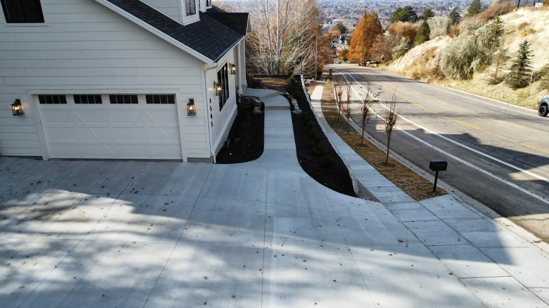 Concrete driveway with landscaping