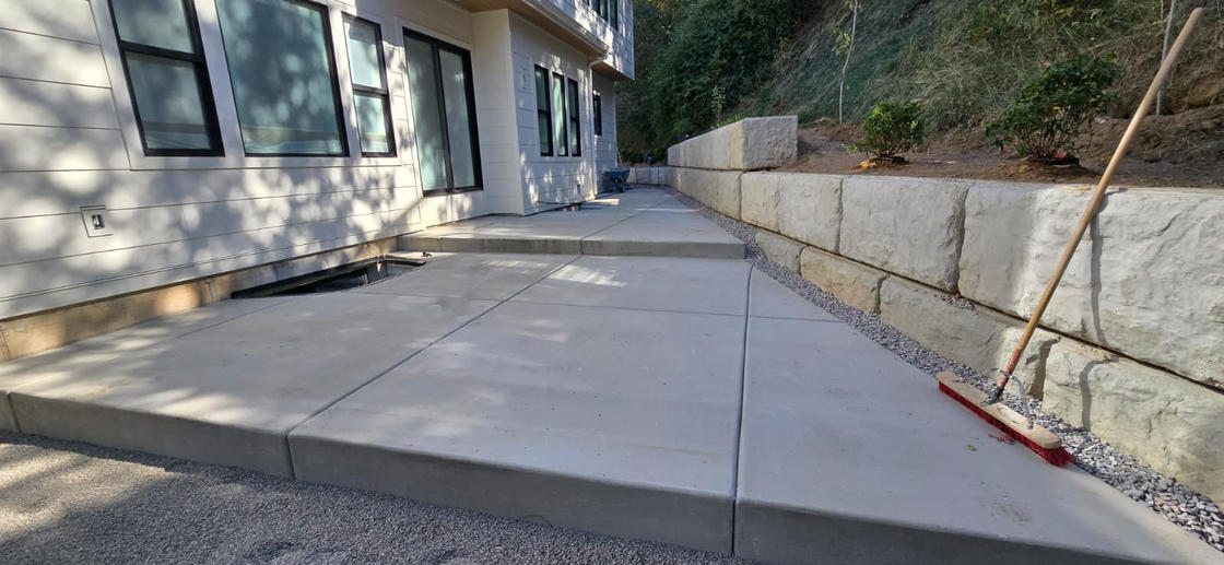 Concrete walkway with retaining wall
