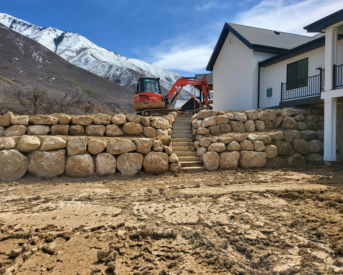 Boulder retaining wall with stairs